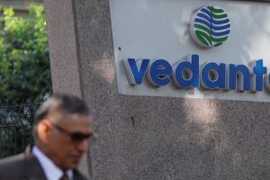 FILE PHOTO: A man walks past the logo of Vedanta outside its headquarters in Mumbai, India January 31, 2018. REUTERS/Danish Siddiqui/File Photo
